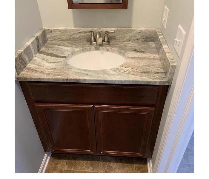 a bathroom sink that has been restored 