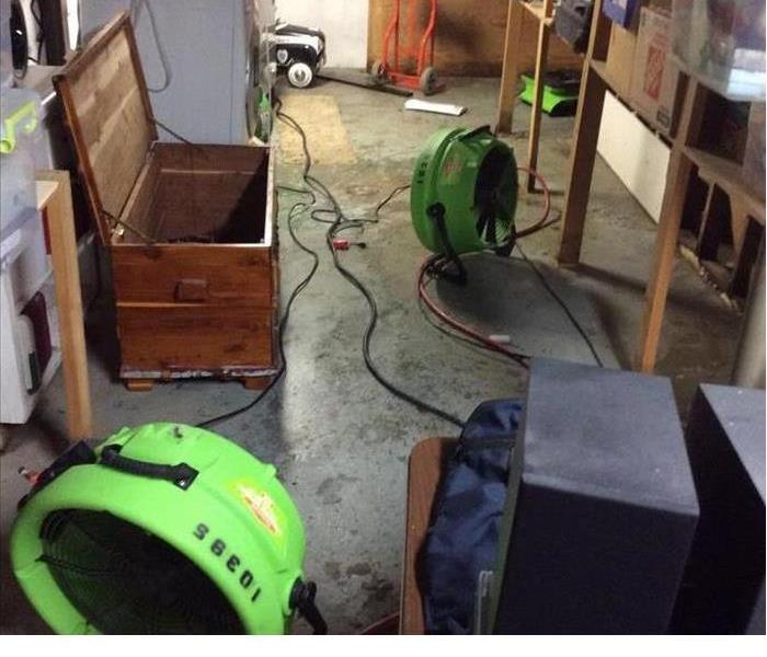 basement that has been remediated by SERVPRO with SERVPRO green dehumidifiers 