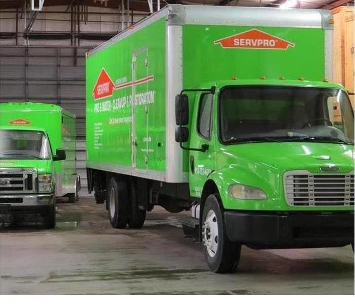 SERVPRO trucks getting ready to drive away to a job 