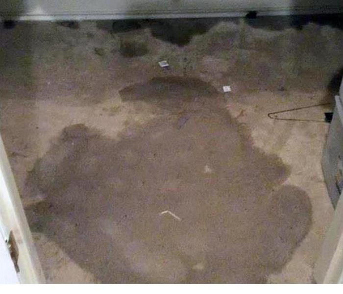 water stain on the floor after a water damage event 