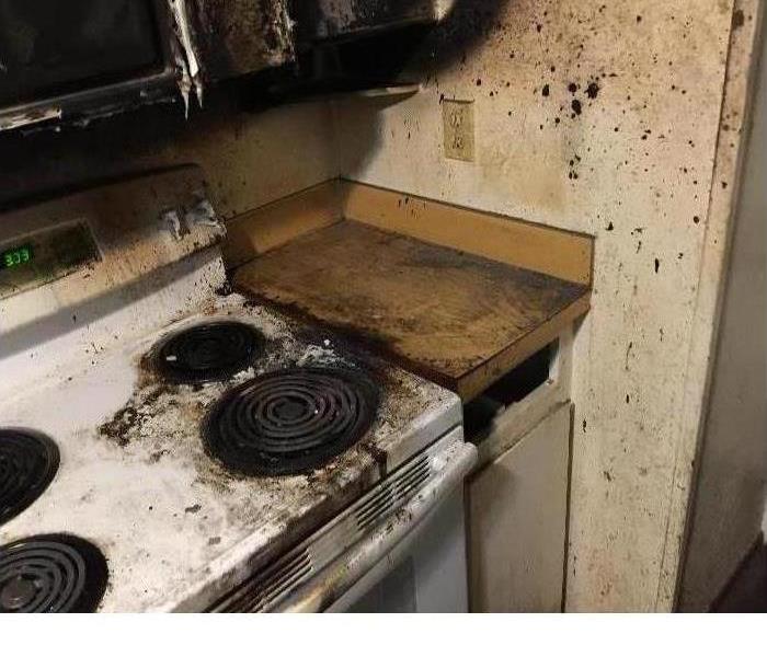a kitchen damaged by fire 